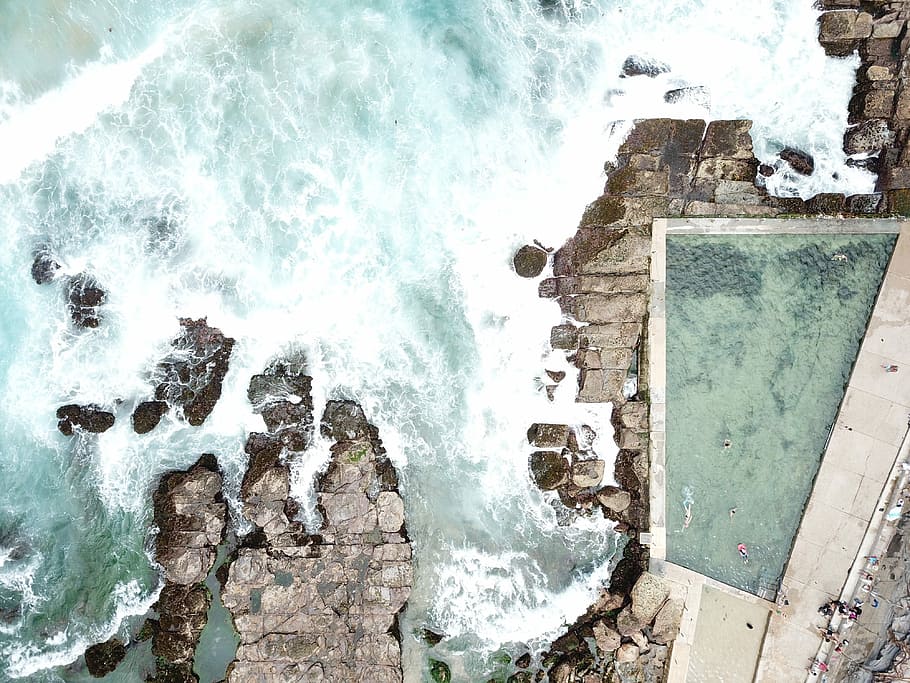 aerial view of seashore, aerial photo of crashing waves of water on ruins HD wallpaper