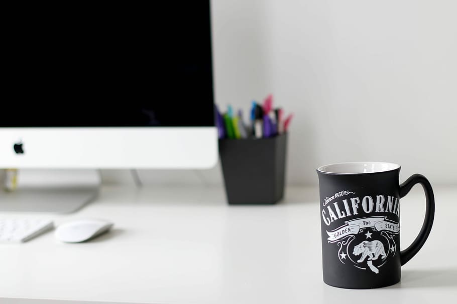 black California printed ceramic mug on table, black California printed ceramic mug near iMac HD wallpaper