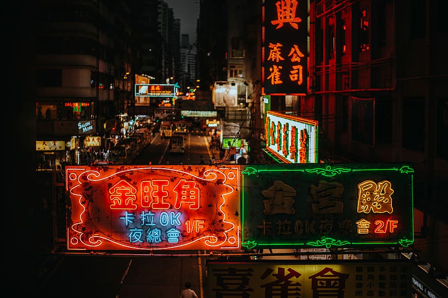 assorted lit kanji script LED signages on buildings during nighttime, red and green LED signage near building