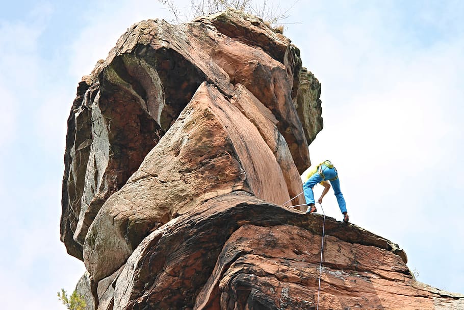 man climbing on brown mountain, rock, climber, abseil, rock wall, HD wallpaper