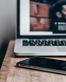 space gray iPhone 6 near MacBook Pro, space gray iPhone 6 beside MacBook Pro turned on HD wallpaper