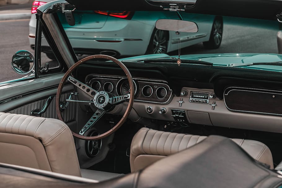 convertible beside white sedan, brown and gray Ford Mustang convertible interior near white vehicle on road HD wallpaper