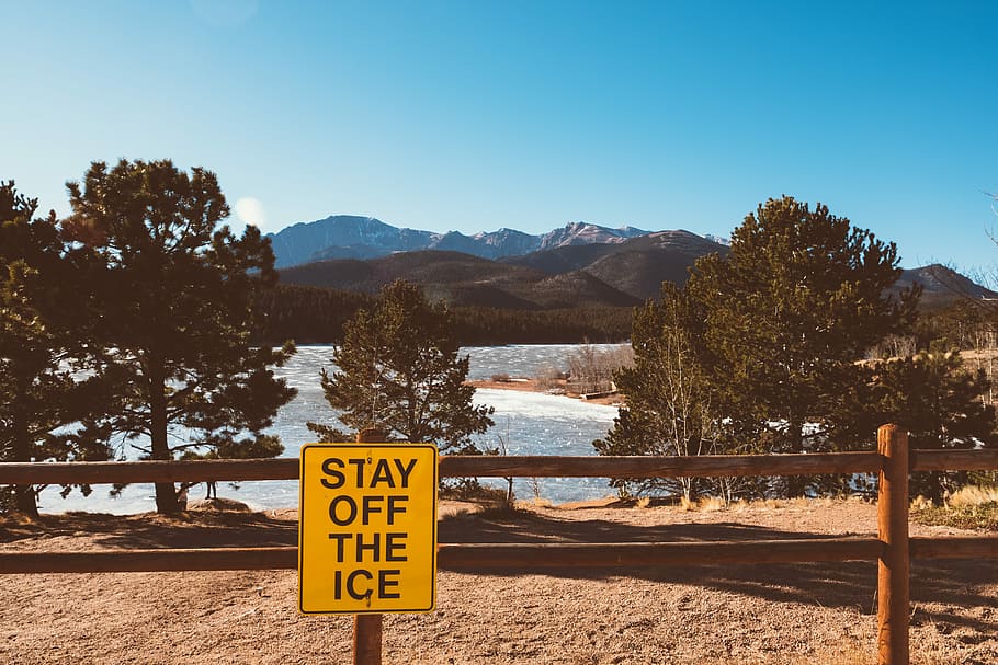 stay of the ice signage attached on fence near trees, stay off the ice signage on brown wooden railing, HD wallpaper