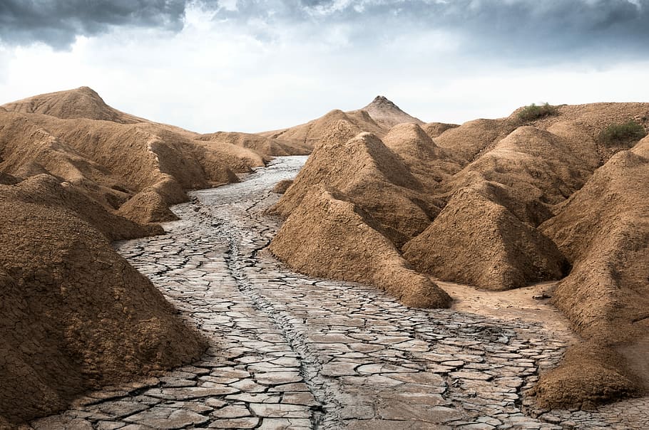 gray dry soil between brown mountains under white clouds, dried river surrounded with mountains HD wallpaper