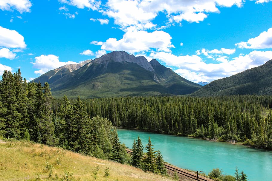 river near mountain under white clouds blue skies daytime, bow river, HD wallpaper