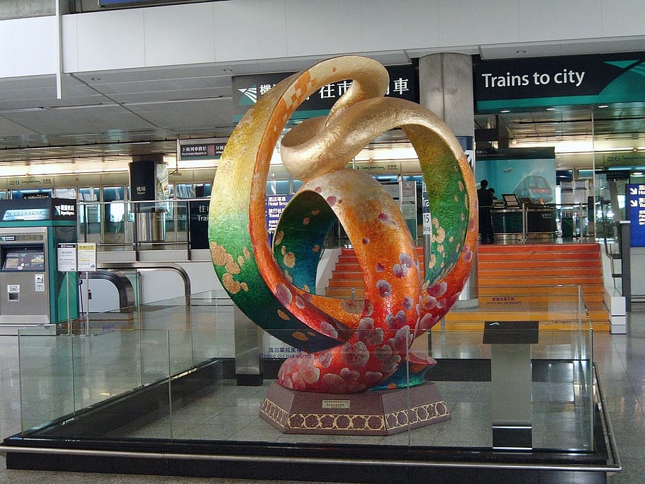 hong kong, airport, statue, indoors, text, western script, illuminated