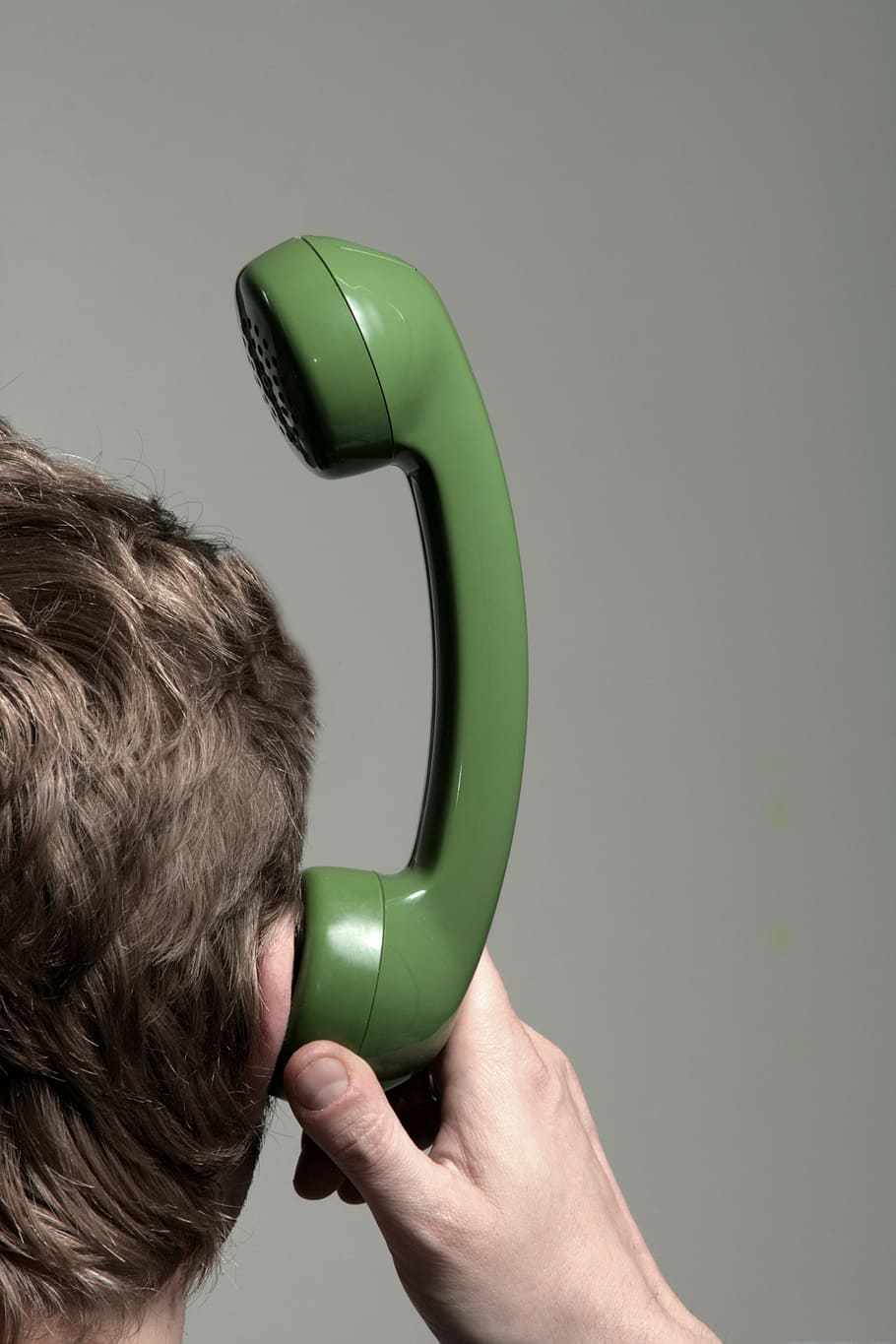 man holding green telephone headset near his ears, communication HD wallpaper