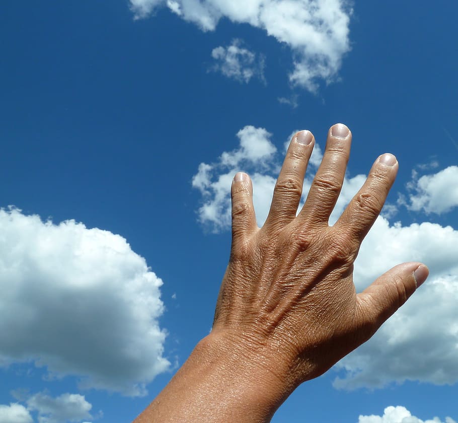 closeup photo of person hand, Clouds, sky, blue, human hand HD wallpaper