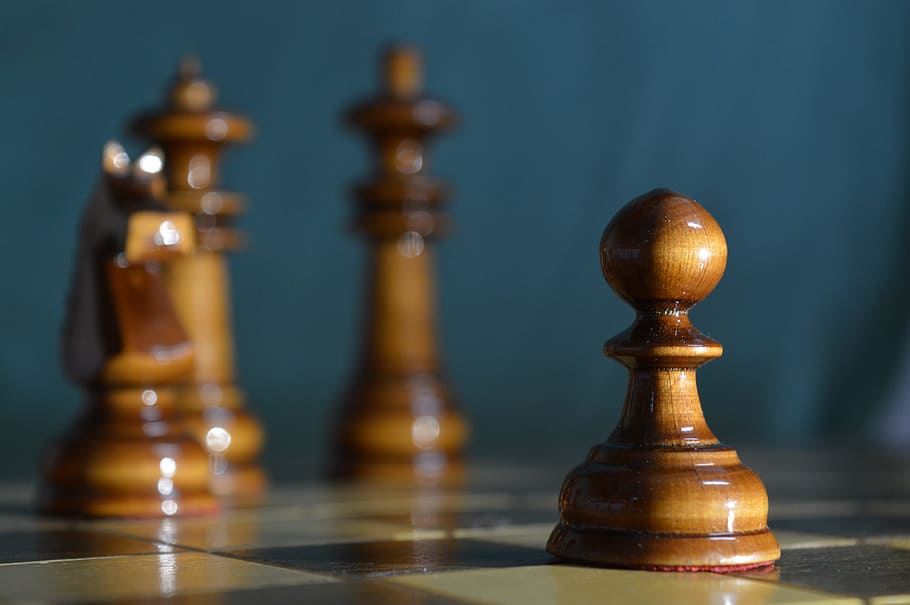 selective focus photography of brown pawn chess piece, royal