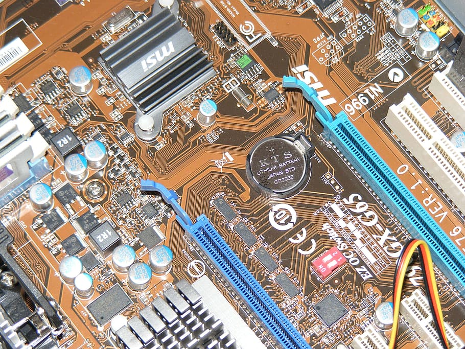 close-up photo of blue and brown computer motherboard, mainboard HD wallpaper