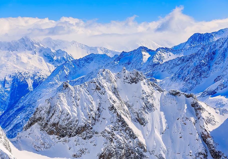 aerial view of mountain coated snow, snow mountain under cumulus clouds HD wallpaper