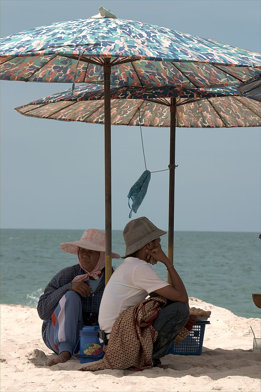 sun, beach, parasol, water, coast, island, sitting, men, real people HD wallpaper