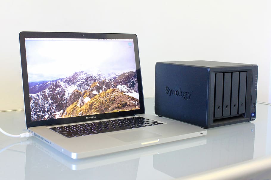 Synology DS418play, Macbook Pro on white surface, computer, laptop HD wallpaper