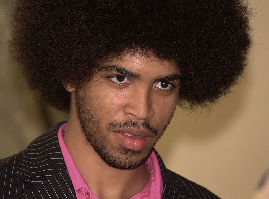 man wearing black and white pinstriped top, Afro, Face, Portrait