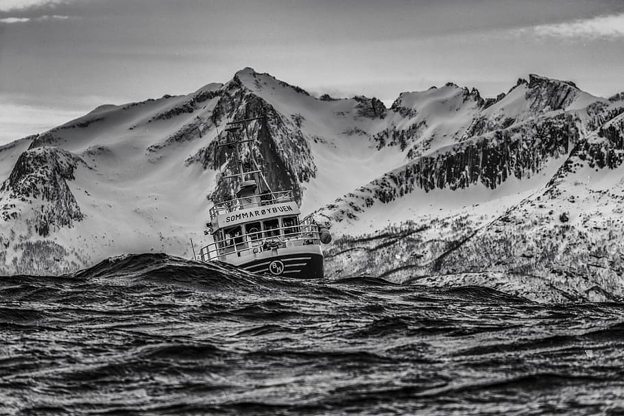 grayscale photography of ship on body of water near at snowy mountain, grayscale photograph of boat in body of water HD wallpaper