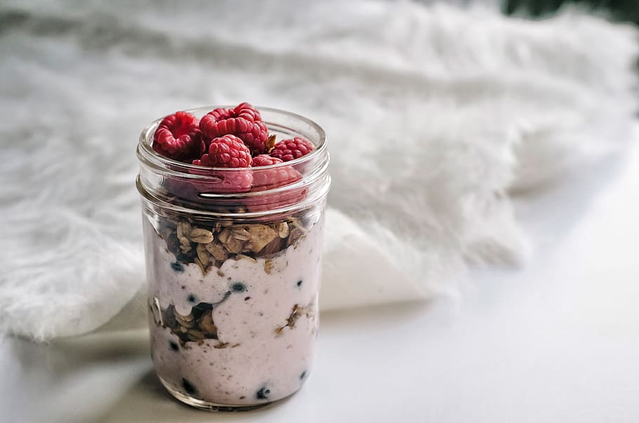 granola and yoghurt filled mason jar, raspberry inside glass cup HD wallpaper