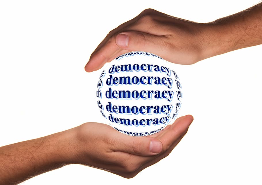 democracy printed text, protection, hands, demokratie, responsibility