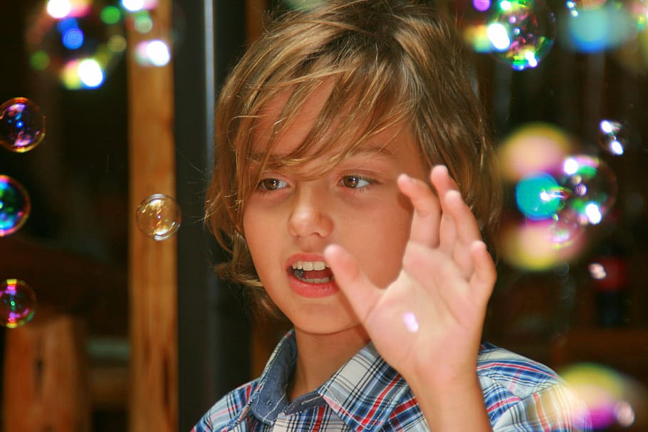 boy playing with bubbles focus photography, child, fun, childhood HD wallpaper