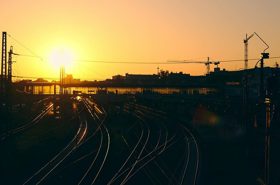 bird's-eye view of train station, silhouette, light, post, sun HD wallpaper