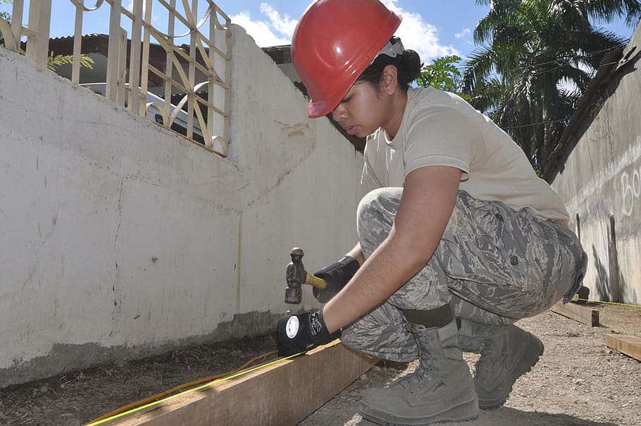 woman holding nail and hammer outdoor, construction, worker HD wallpaper