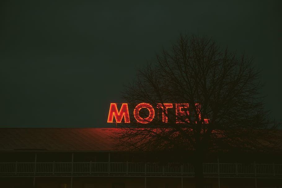red neon light Motel signage turned ON, holiday, vacation, hotel