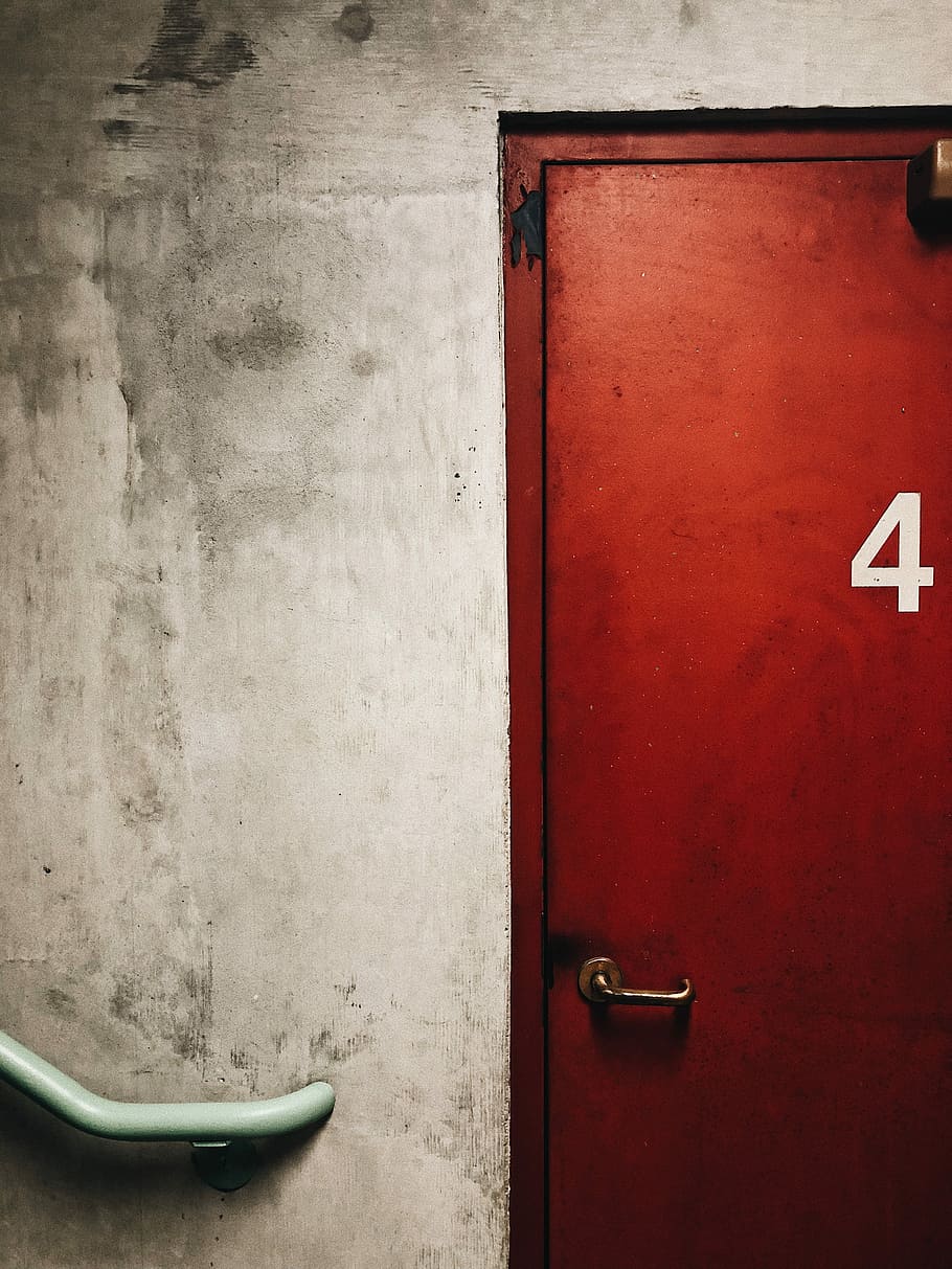 red door beside staircase, closed red metal door, building, wall HD wallpaper