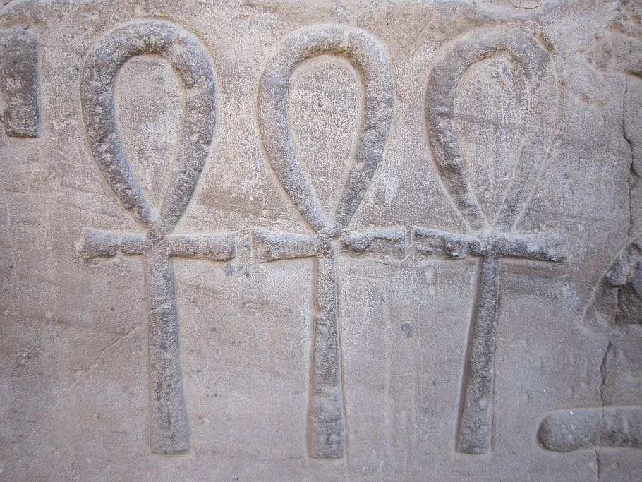 three life symbol embossed on concrete surface, ankh, egypt, hieroglyphics