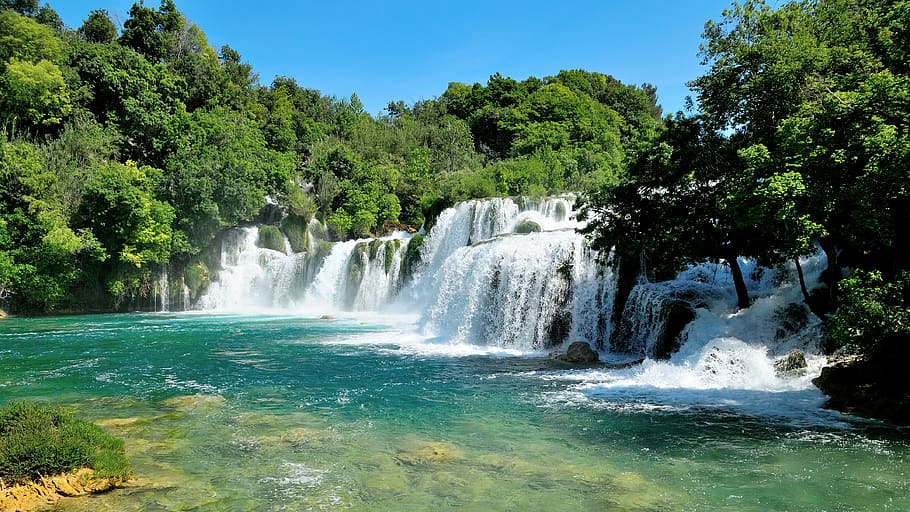 body of water across forest during daytime, krka, waterfall, croatia