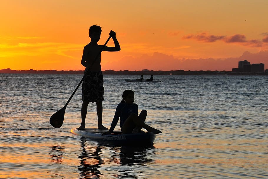 silhouette of man rowing boat, sea, sunset, key biscayne, miami