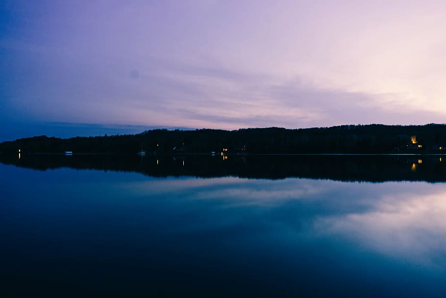body of water near mountain, silhouette, island, nighttime HD wallpaper