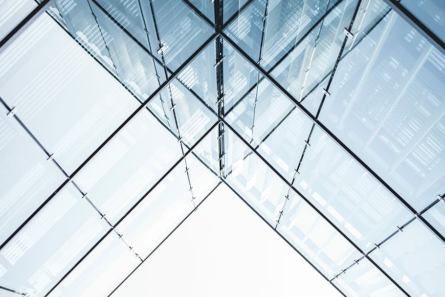 curtain wall building under white sky, worm's eye view of a glass building HD wallpaper