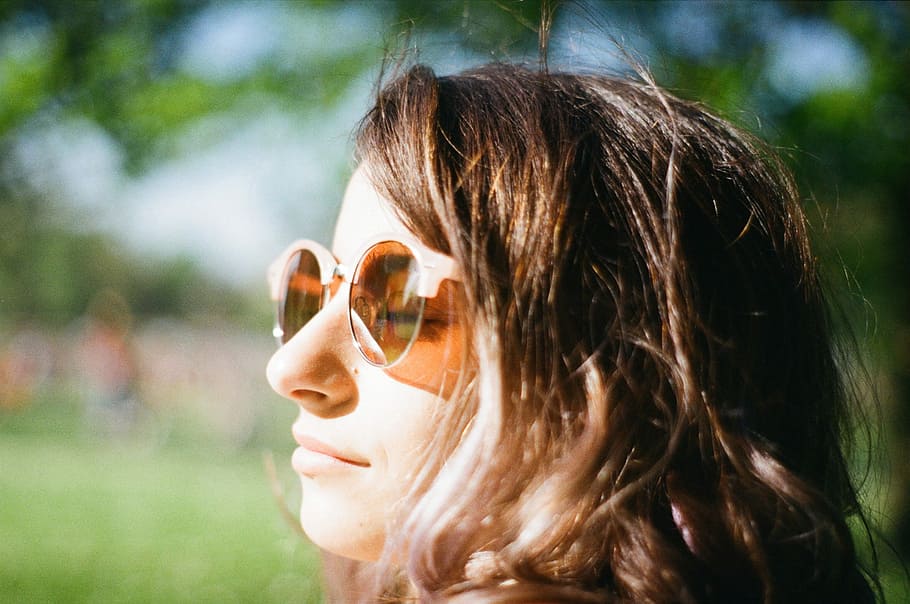 woman closing her eyes wearing brown lens sunglasses, closeup photo of woman wearing sunglasses HD wallpaper