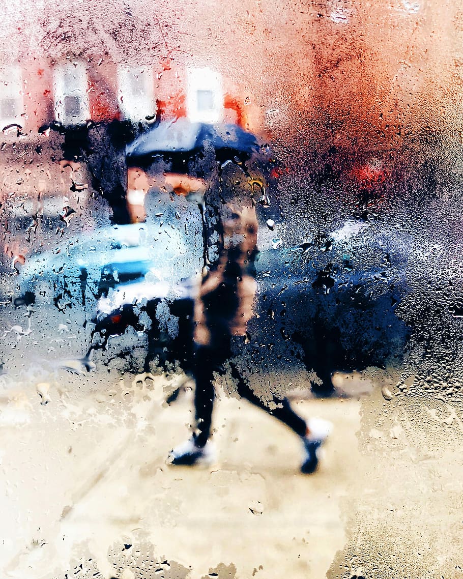 man walking on street, moist glass photo of person holding umbrella walking on concrete road HD wallpaper