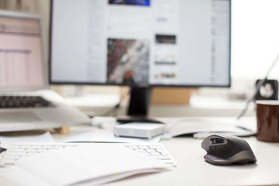 selective focus photography of cordless keyboard and mouse on white wooden desk HD wallpaper