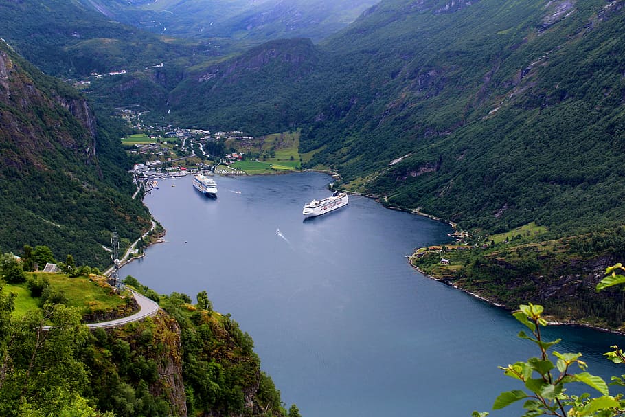 two cruise ships on dock, geiranger, norwegian fjord, panoramic