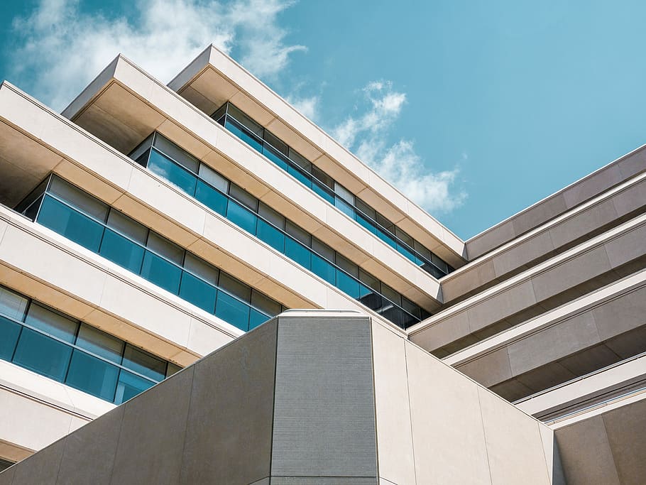 low angle photo of beige concrete building under cloudy sky, building photo HD wallpaper