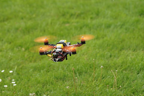 black and yellow drone above ground, field, multicopter, sport HD wallpaper