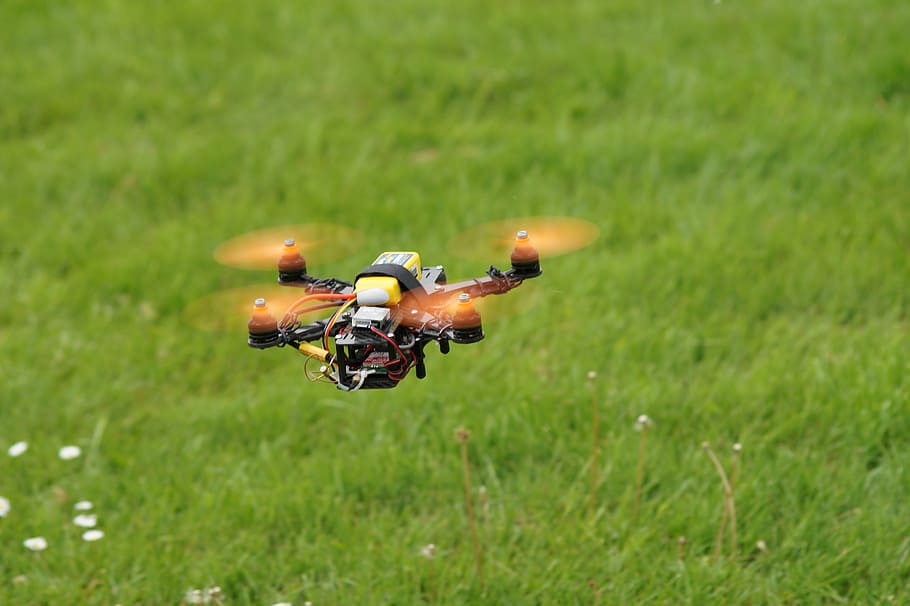 black and yellow drone above ground, field, multicopter, sport HD wallpaper