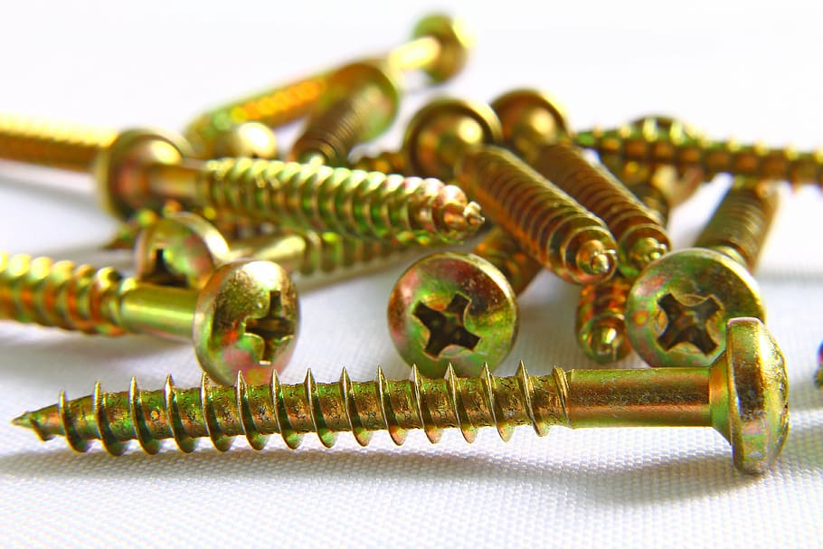 brass-colored screwdrivers, screws, spirals, slit, carpentry