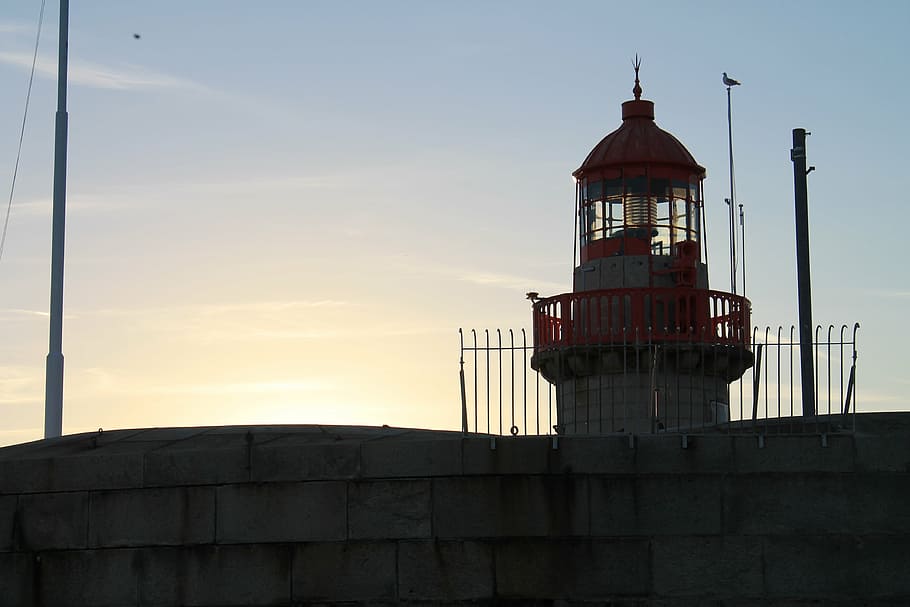 lighthouse, sunset, sea, dublin, port, coast, water, sky, evening HD wallpaper