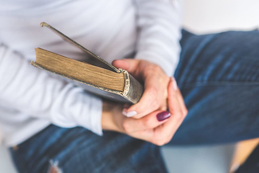 person holding black leather book, old book, closed, hands HD wallpaper