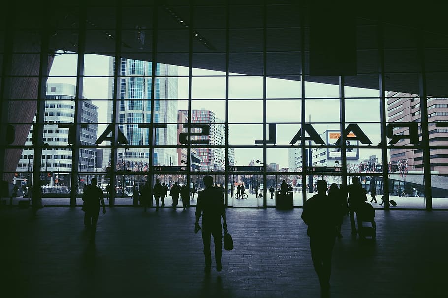 silhouette of people in glass building during daytime, train station HD wallpaper