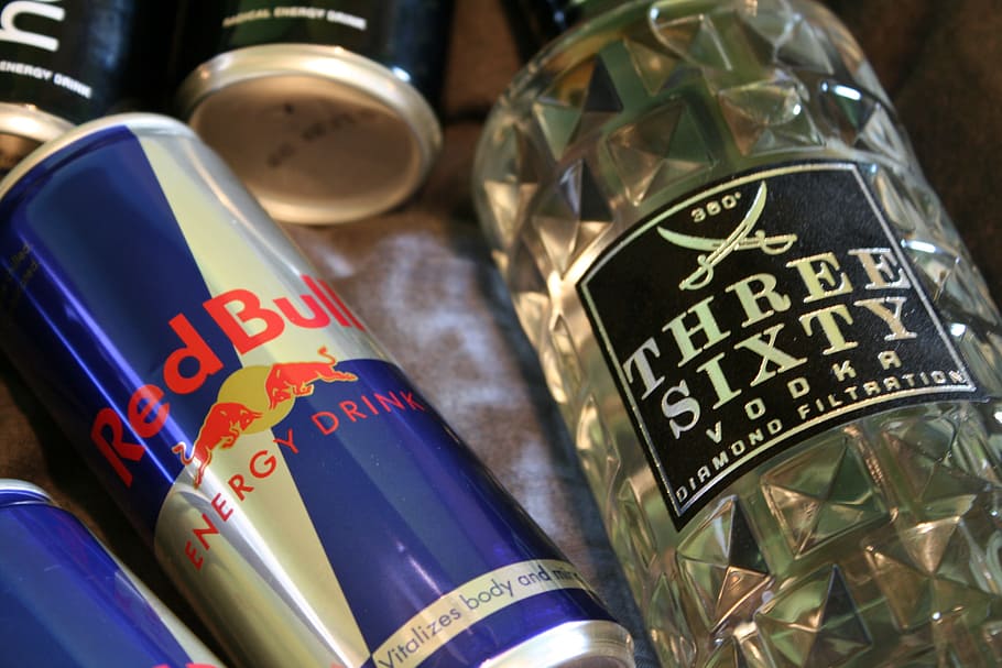 Red Bull energy drink can and Three Sixty vodka bottle, alcohol