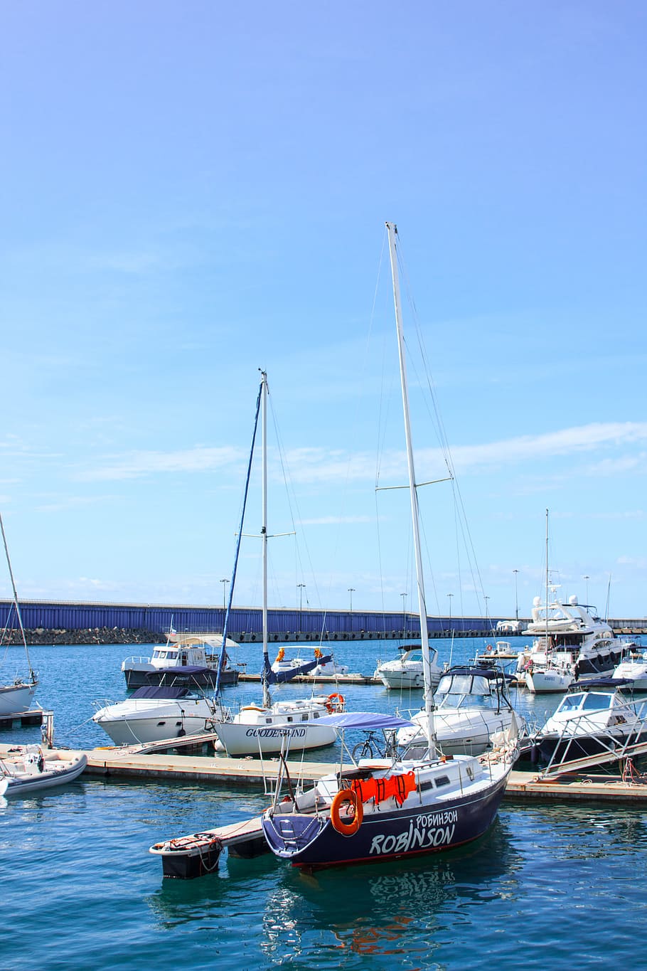 White and Black Robinson Yacht Beside Dock, boats, clouds, daylight HD wallpaper