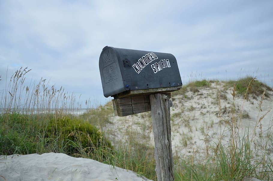 shallow focus photography of mailbox surrounded by grass, mailbox in seashore HD wallpaper