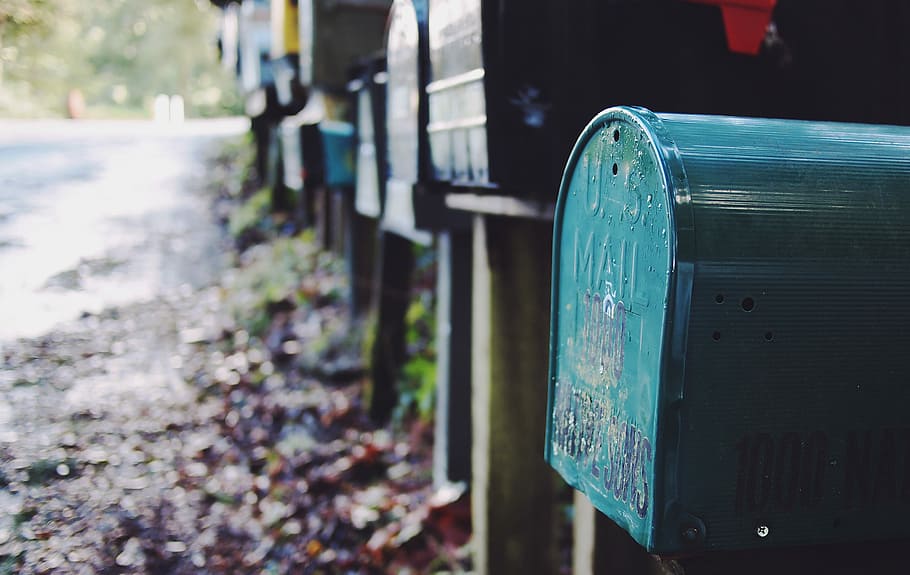 tilt shift photography of green mailbox, selective focus photo of mail boxes near road HD wallpaper