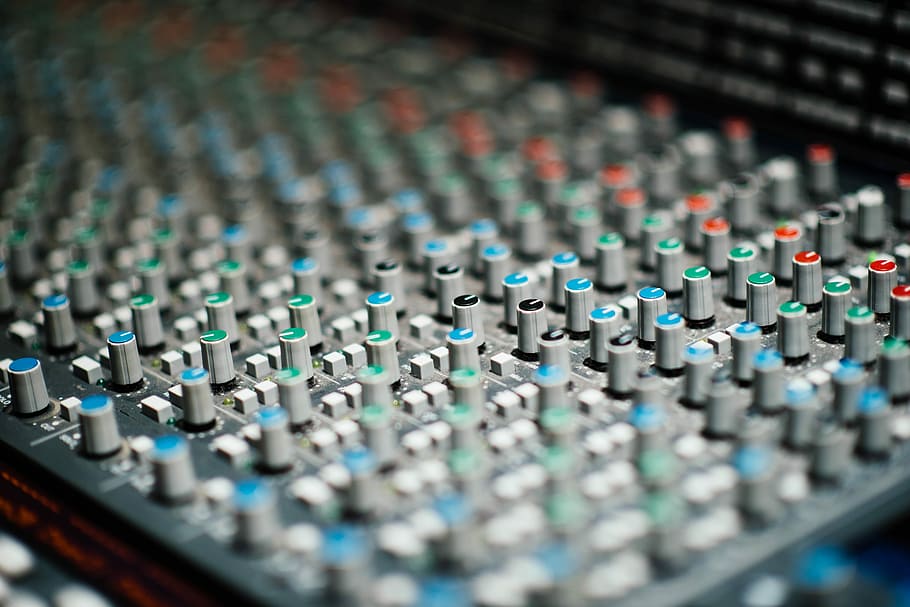 black and gray mix sync console, gray and black audio mixer selective focus photography