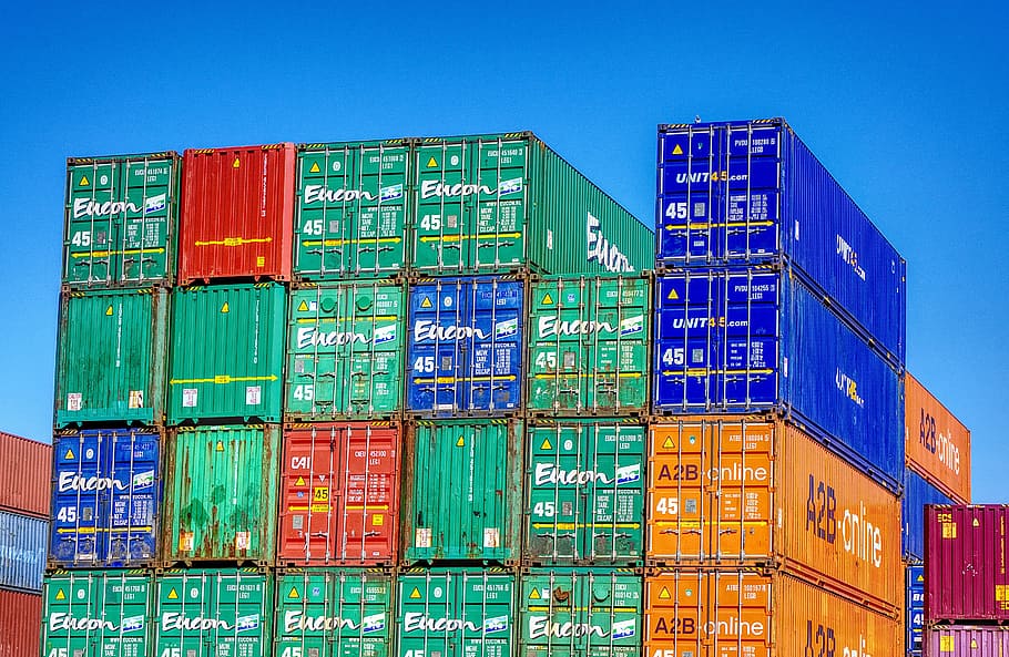 pile of assorted-color intermodal containers, port, loading, stacked