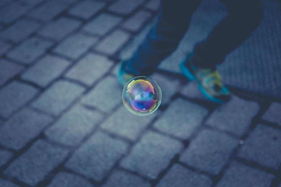 floating bubble near person running, multicolored bubble shallow focus photography HD wallpaper