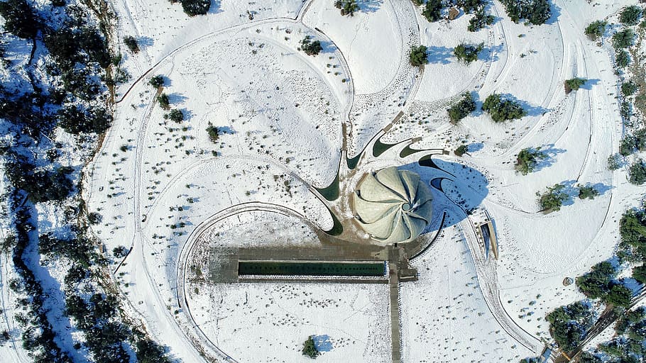 aerial photography of grey concrete structure surrounded by trees at daytime, aerial photography of dome building at daytime HD wallpaper